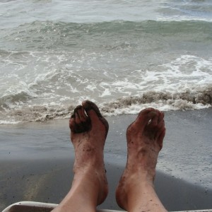 Black sand on my feet