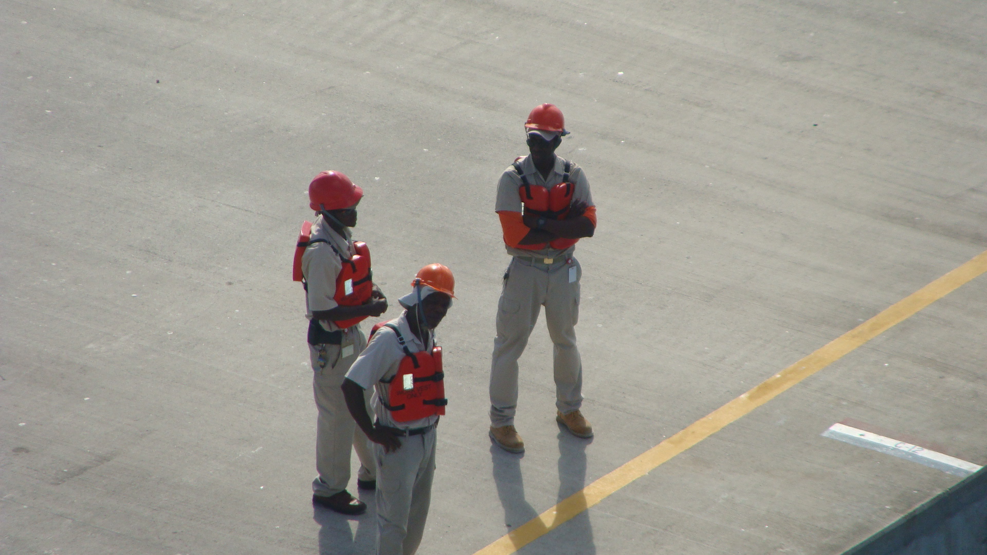 Dockworkers await our arrival