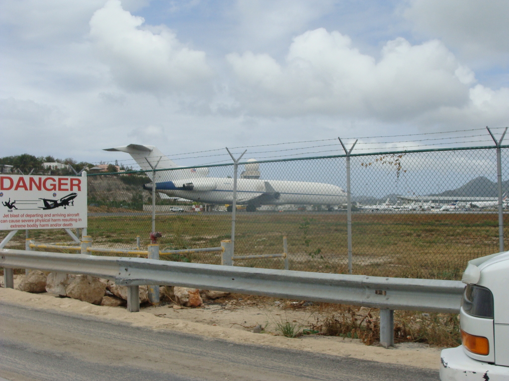 Jet taking off - note sign